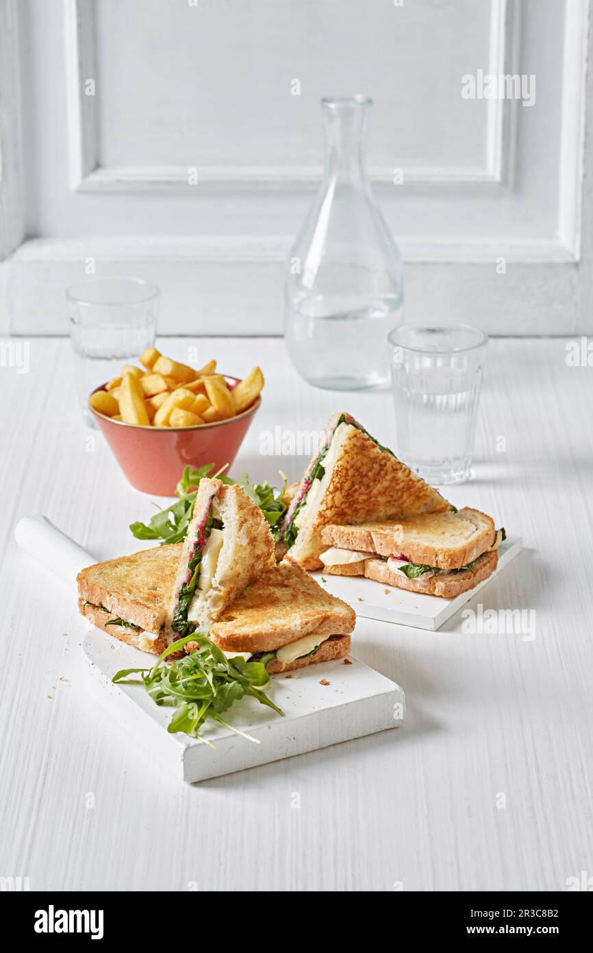 Brie, cranberry and rocket toasted sandwiches Stock Photo