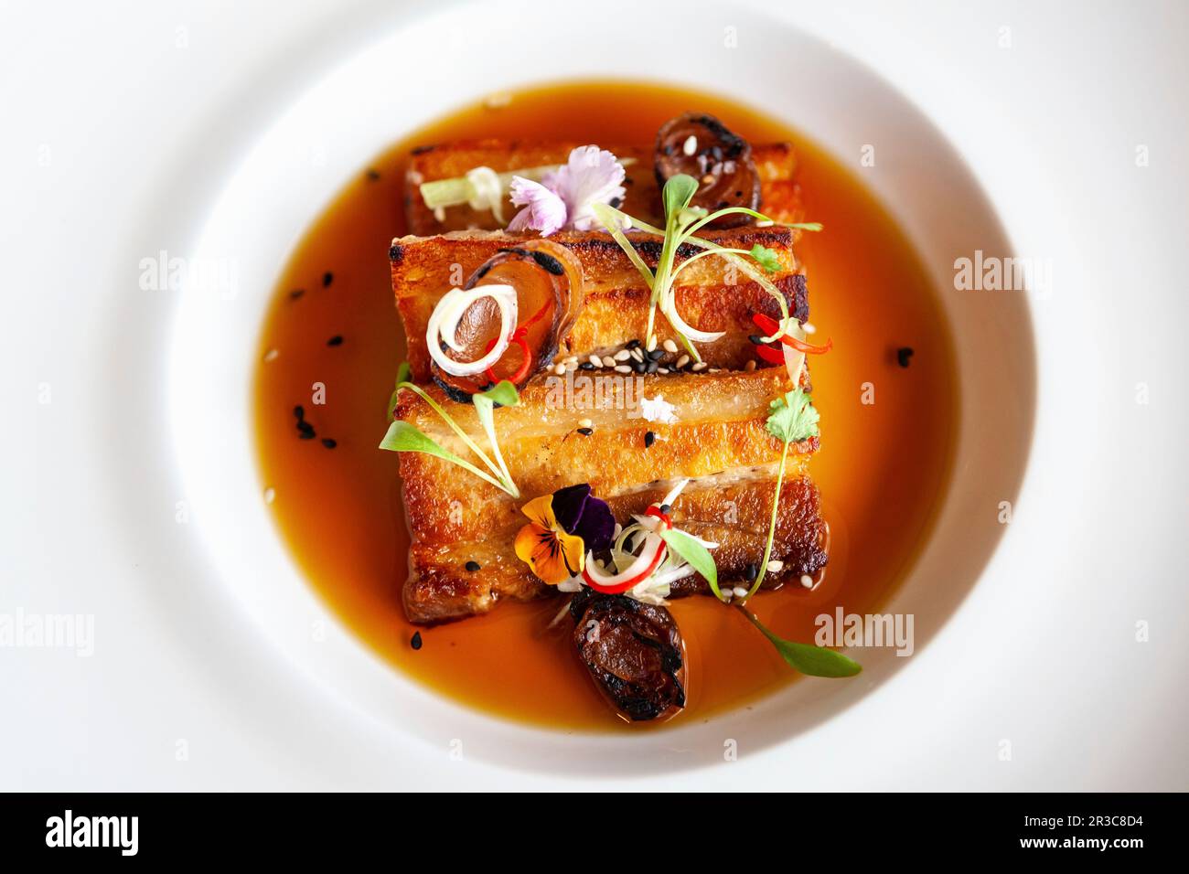 Pork belly with vermouth jus Stock Photo Alamy