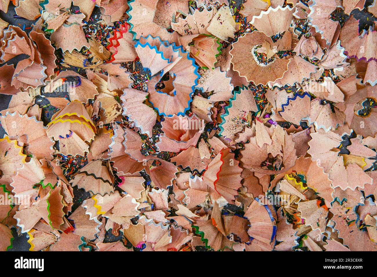 Background of multicolor pencil shavings. Close up colorful pencil shavings for background. Dynamic, Stock Photo