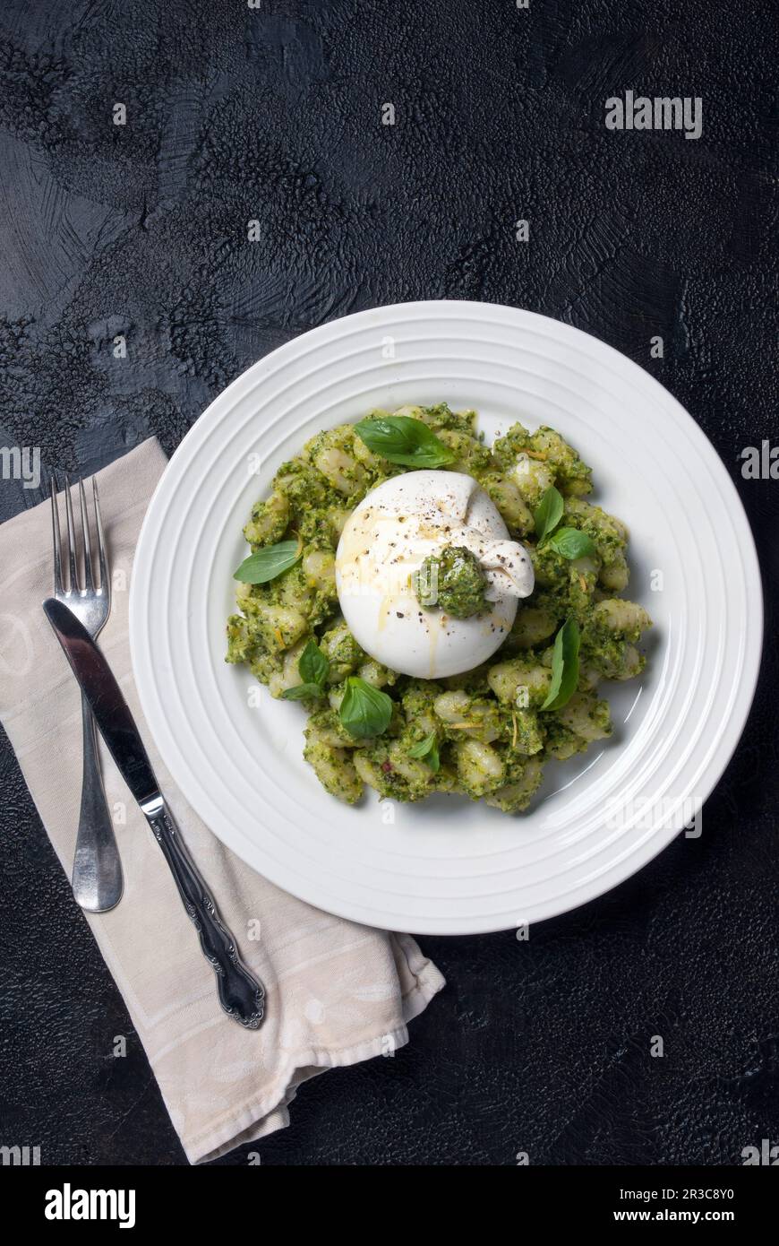 Gnocchi pasta with pesto and burrata Stock Photo Alamy