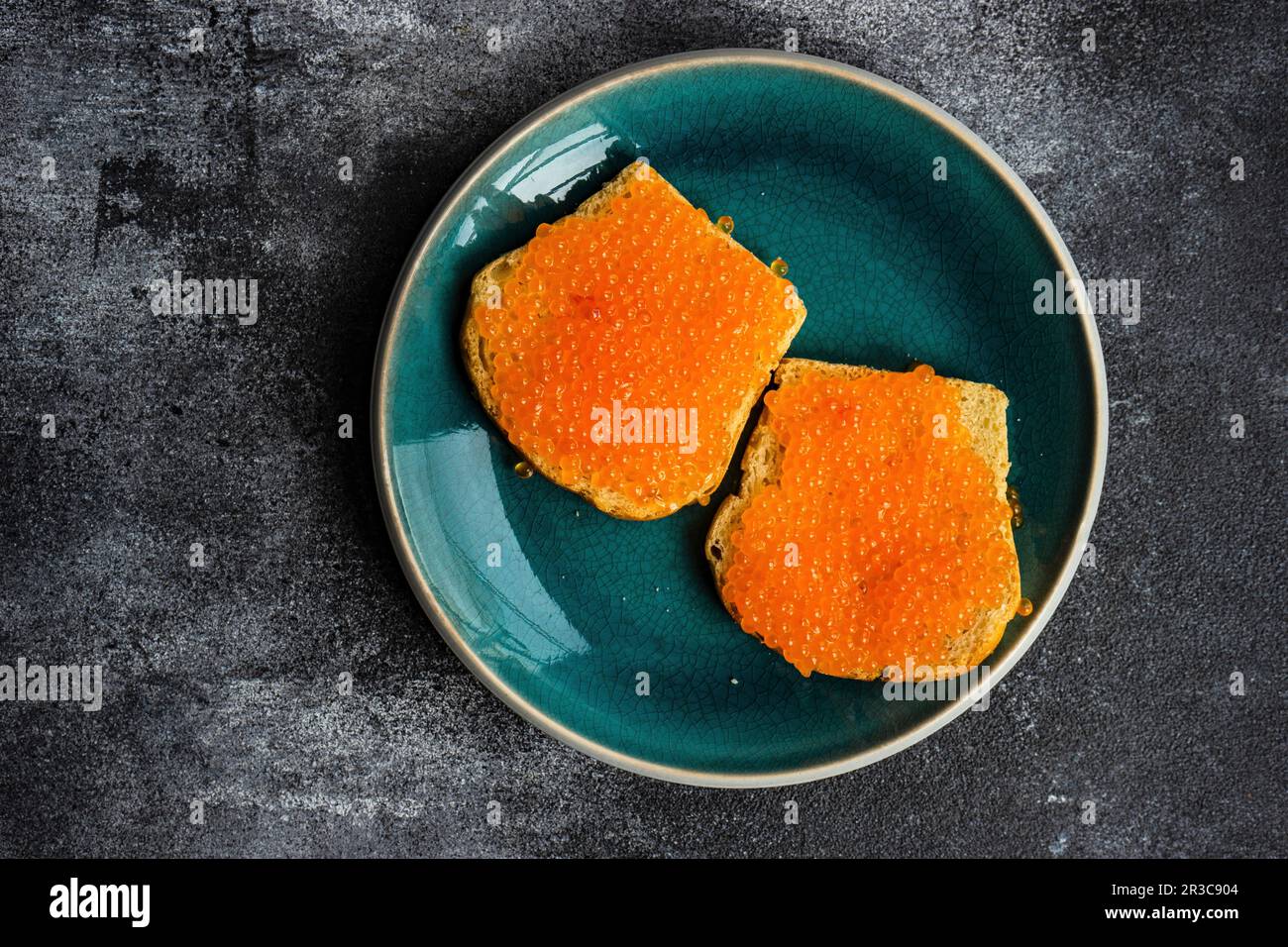 Red fresh trout fish caviar served in a bowl Stock Photo