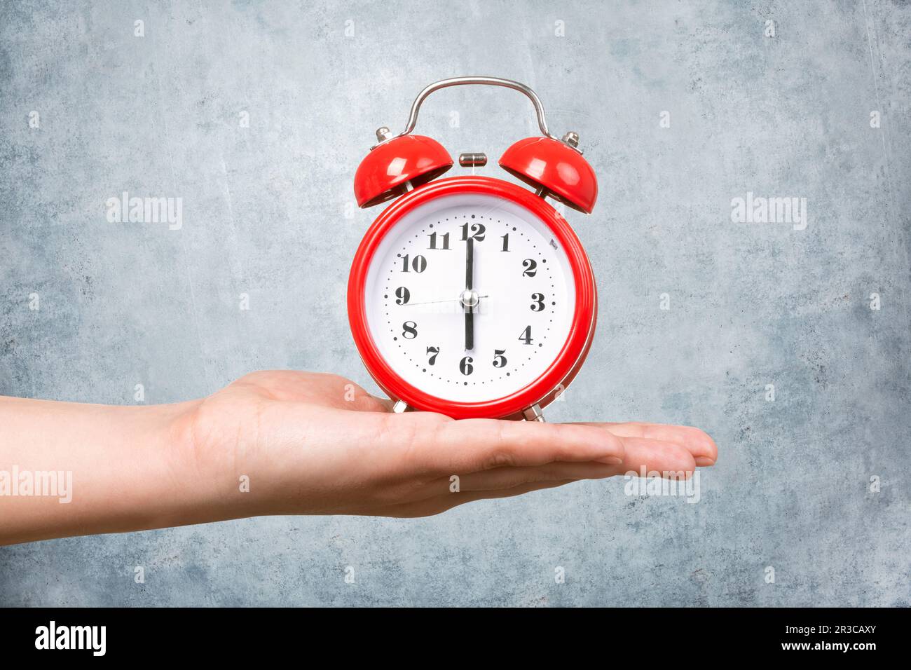 Red clock with alarm Stock Photo Alamy