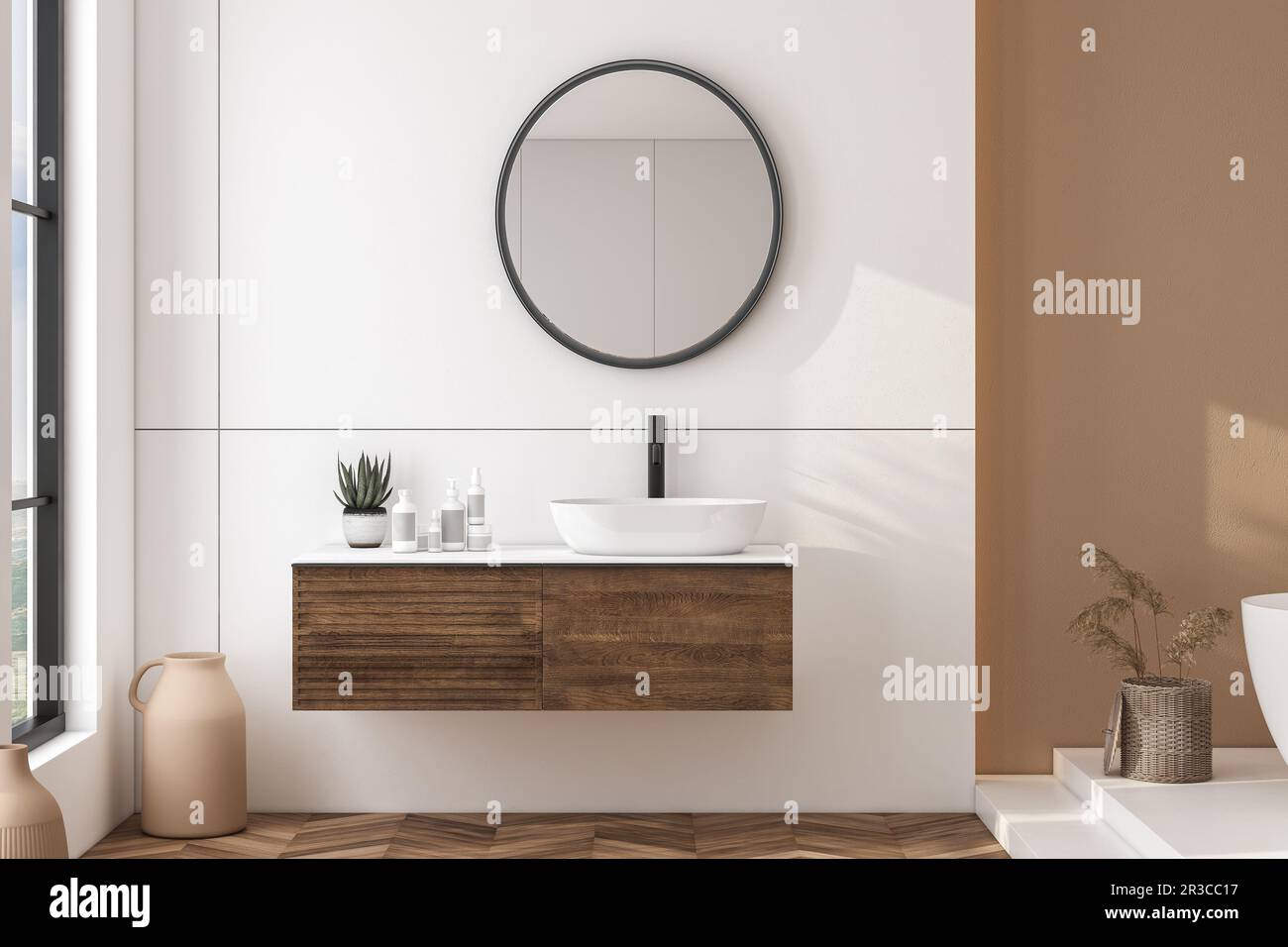 Modern bathroom interior with beige walls, white sink with oval mirror ...