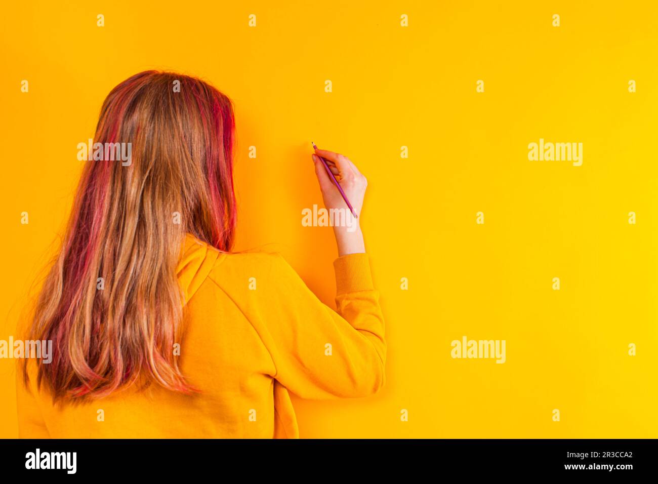 Young girl writing message for future generations Stock Photo