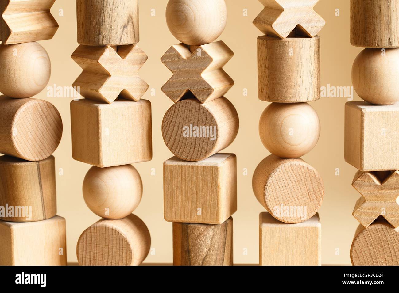 Children's wooden toys. Sequencing Blocks learning resource for educating shapes, fine motor skills, Stock Photo