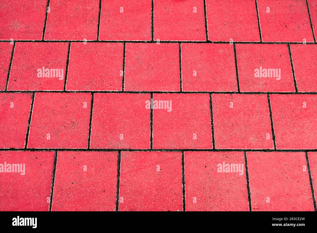 Red floor tiles are vibrant and durable, adding a touch of color and