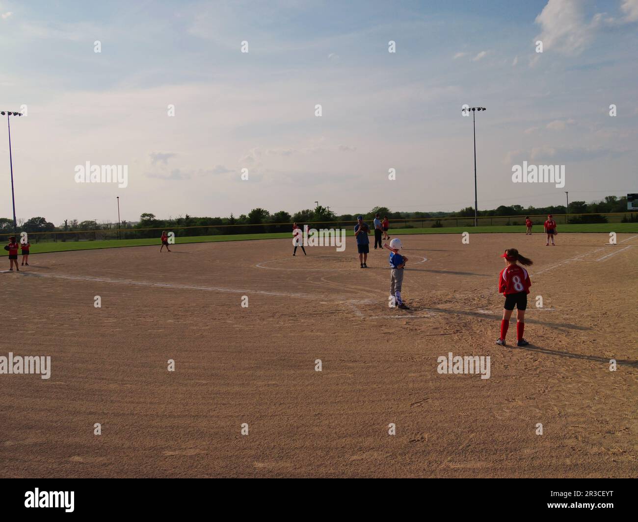 Girls Softball at a Local Park Baseball Field Stock Photo