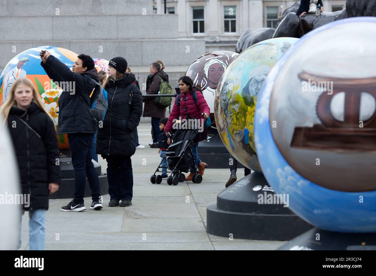 Globes made by artists.are seen as part of The World Reimagined installation for racial justice in Trafalgar Square, London. Stock Photo