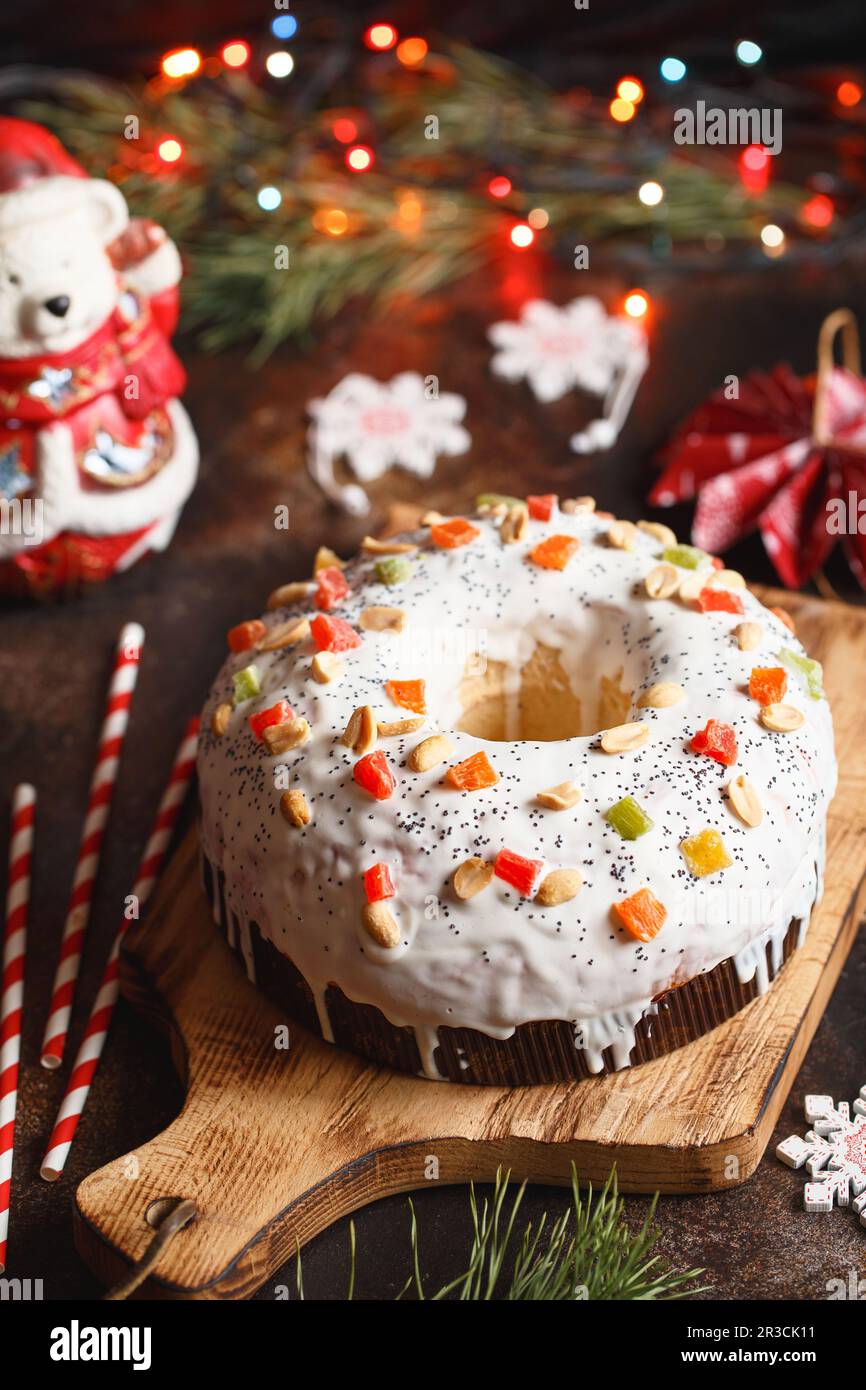 Christmas cake with fruits and nuts. Fruit cake. Christmas baking. Preparations for the holiday. Chr Stock Photo