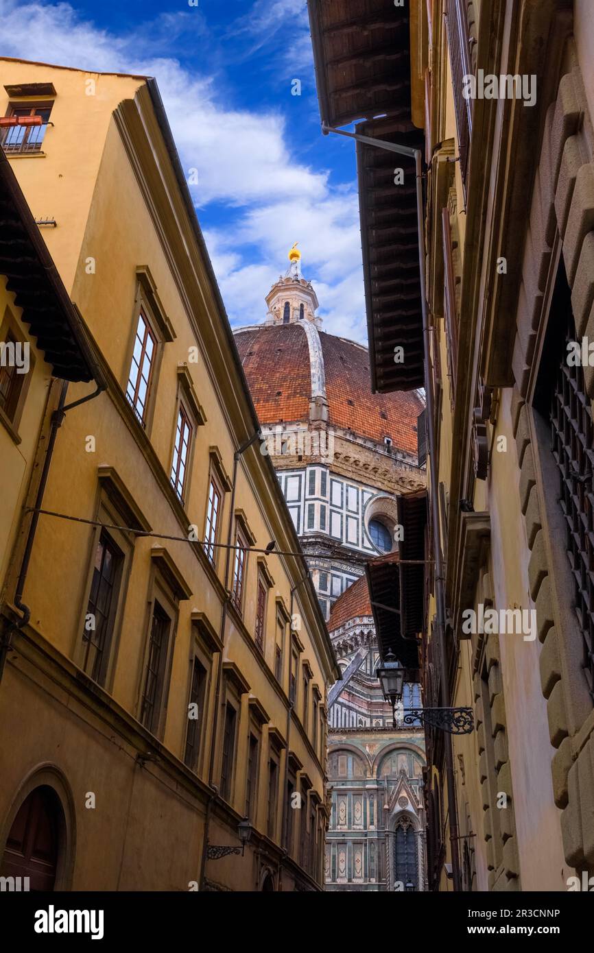 Street view of Florence: glimpse of Brunelleschi's Dome. Stock Photo