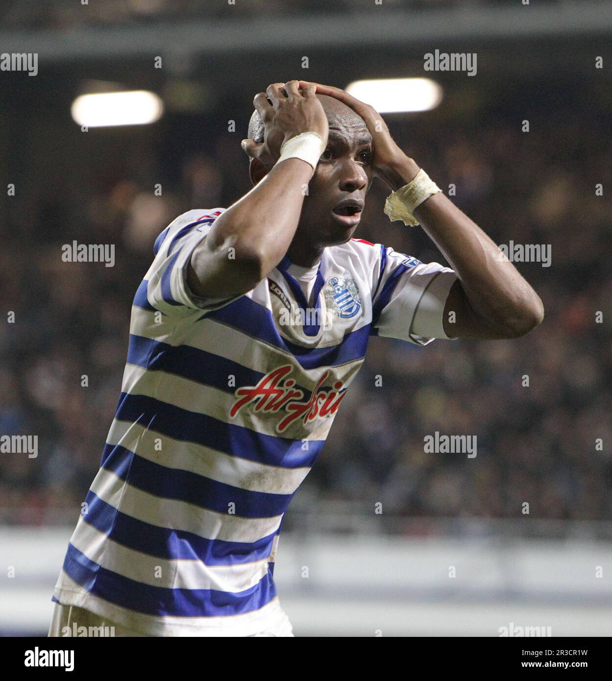 Queens Park Rangers' Stephane Mbia is distraught after his appeal for a penalty after West Bromwich Albion's Liam Ridgewell arm touched the ball. Pena Stock Photo