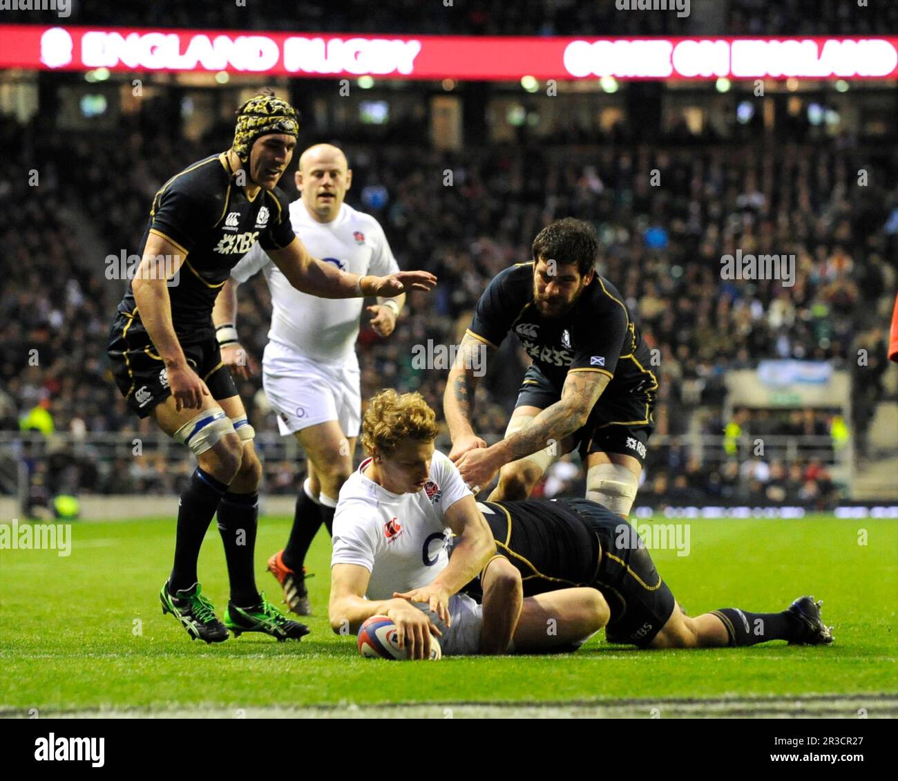 Billy Twelvetrees of England dives over to score a try on his debut during the RBS 6 Nations match between England and Scotland at Twickenham on Satur Stock Photo