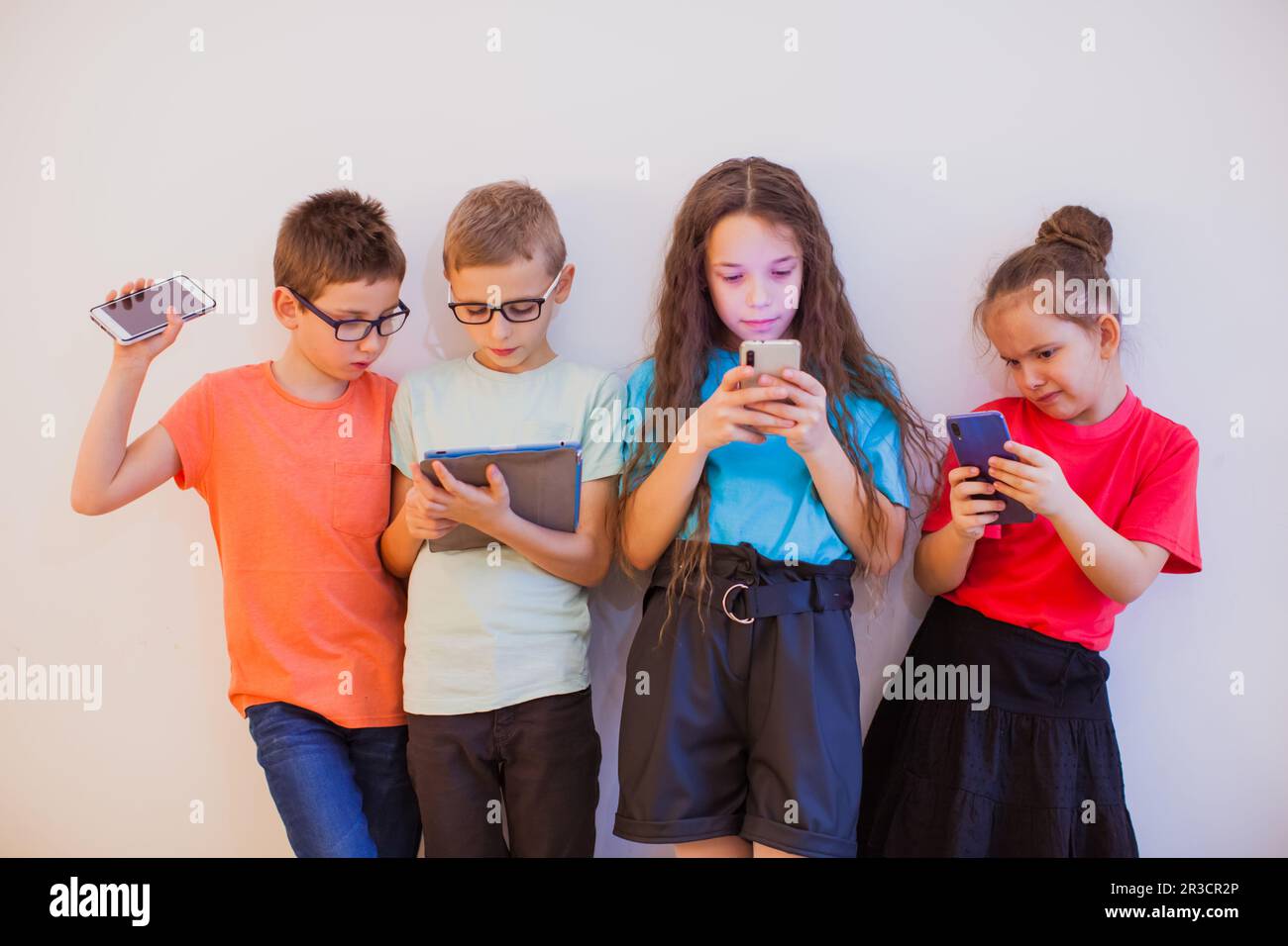 Kids and gadgets are best frieds in modern life Stock Photo