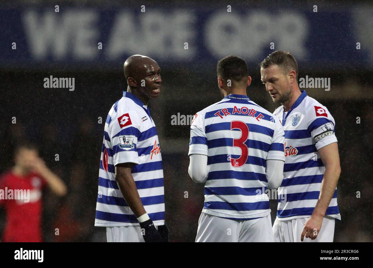 Queens Park Rangers' Stephane Mbia (L) Queens Park Rangers' Armand Traore (M) Queens Park Rangers' Clint Hill (R.) have a chat while Queens Park Range Stock Photo
