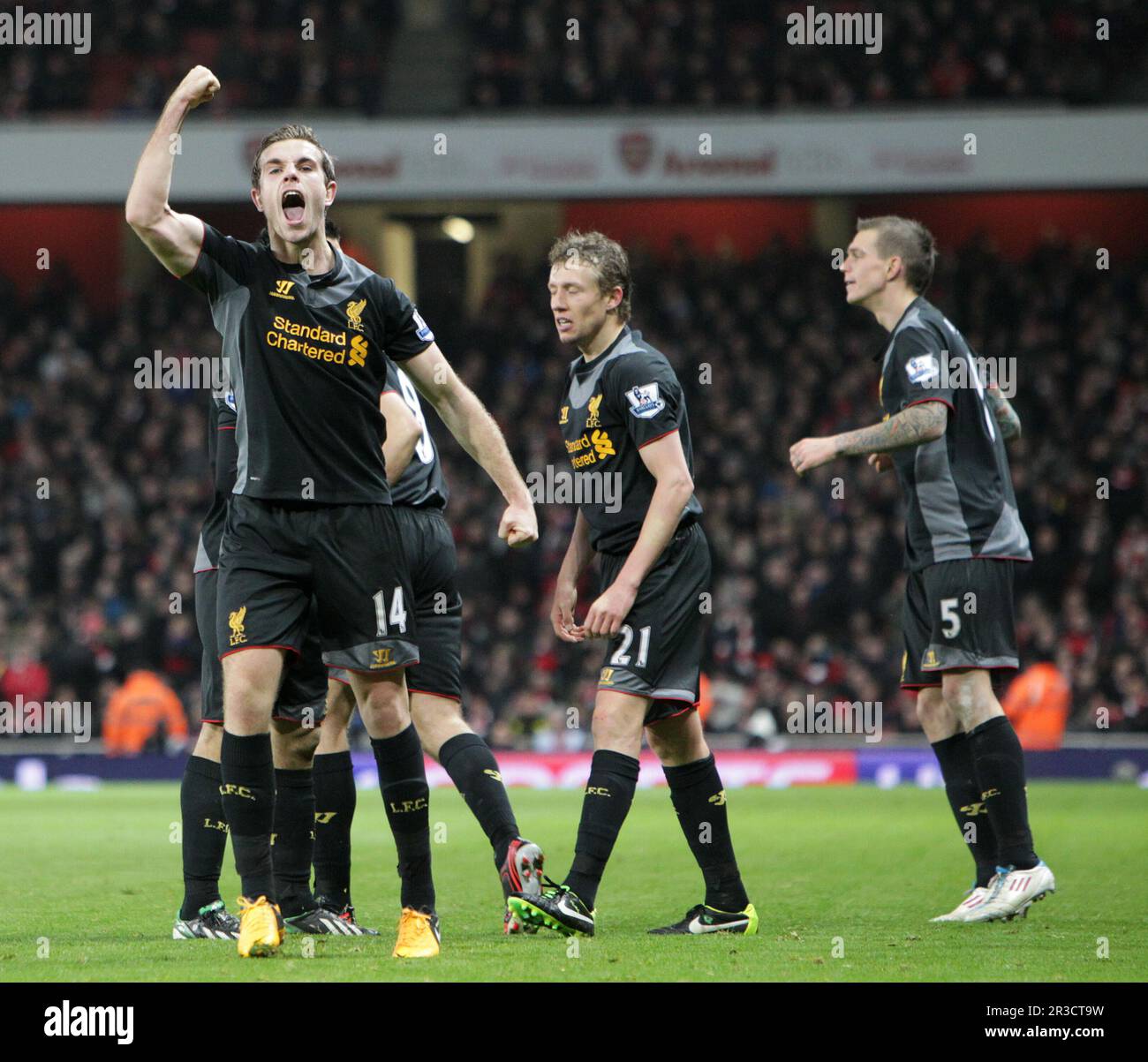 Liverpool's Jordan Henderson celebrates scoring his sides second goal with his team mates. Final score Arsenal drew against Liverpool 2:2Arsenal 30/01 Stock Photo