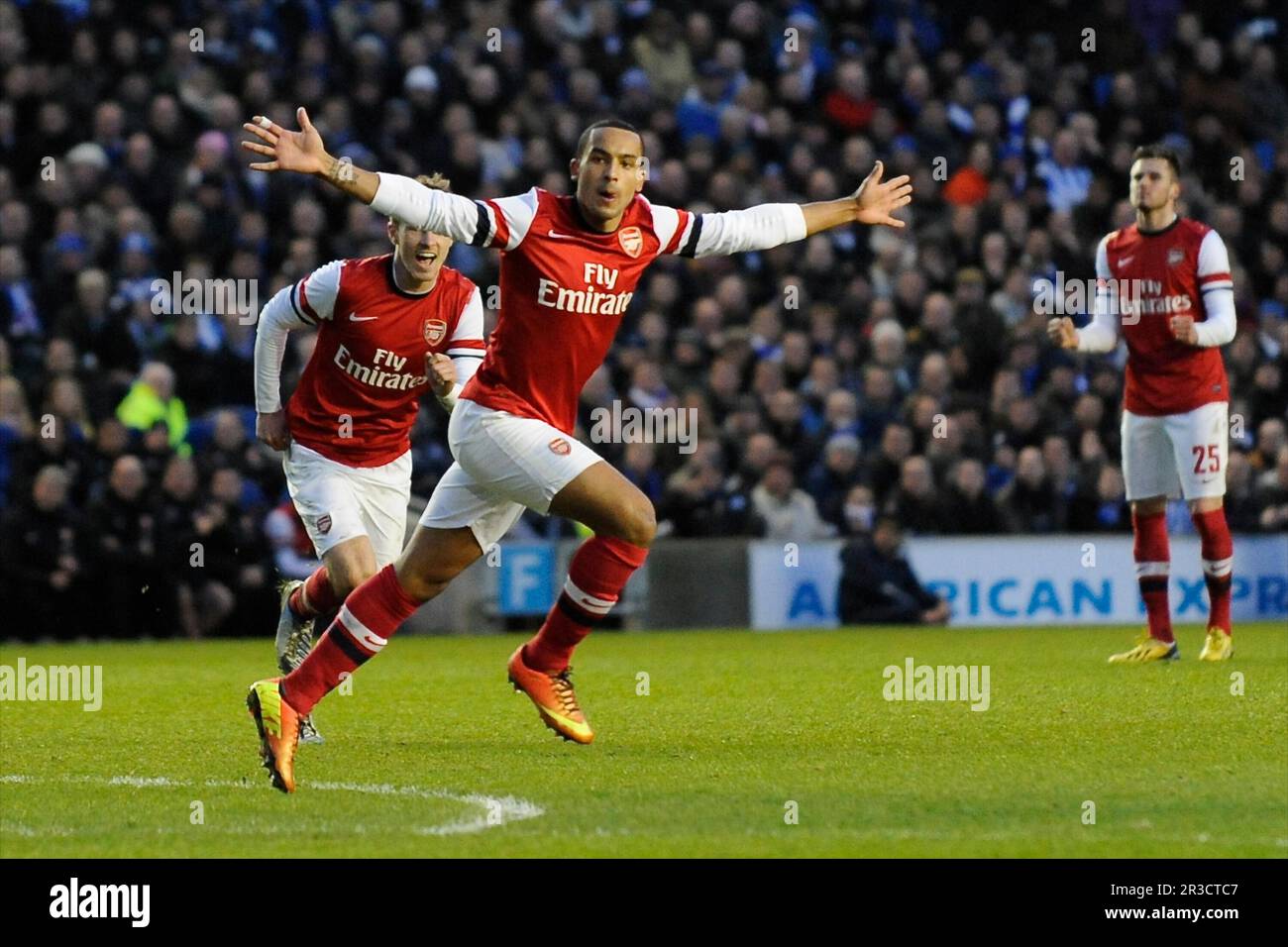 Theo Walcott of Arsenal celebrates scoring a goal during the FA Cup 4th Round match between Brighton & Hove Albion and Arsenal at the American Express Stock Photo