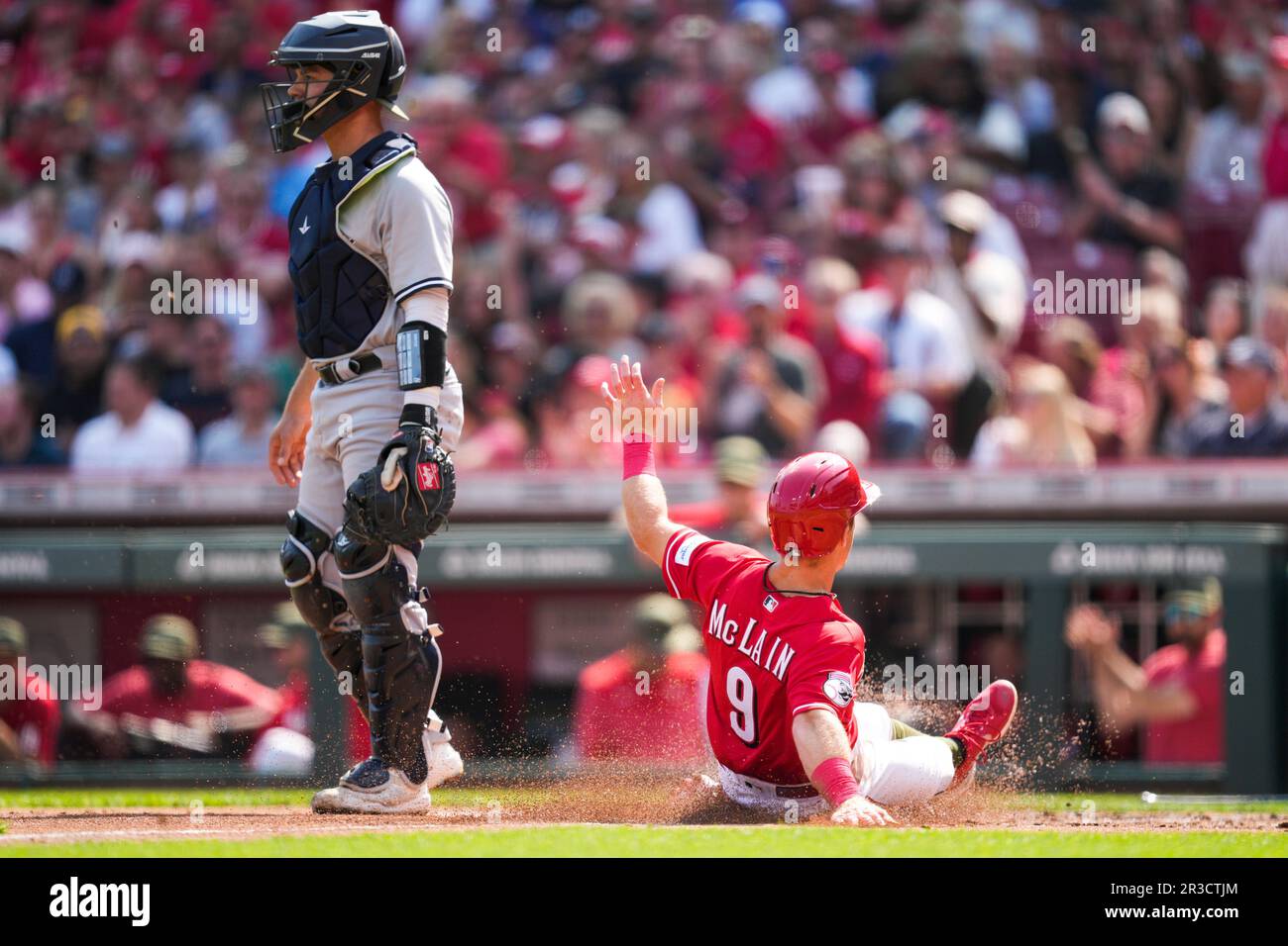 Cincinnati Reds' Matt McLain (9) scores as New York Yankees catcher