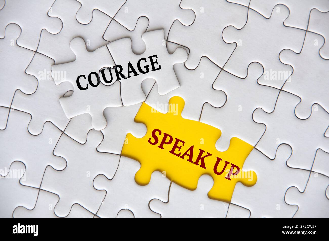 Courage to speak up text on missing jigsaw puzzle representing business  culture in exercising speak up Stock Photo - Alamy