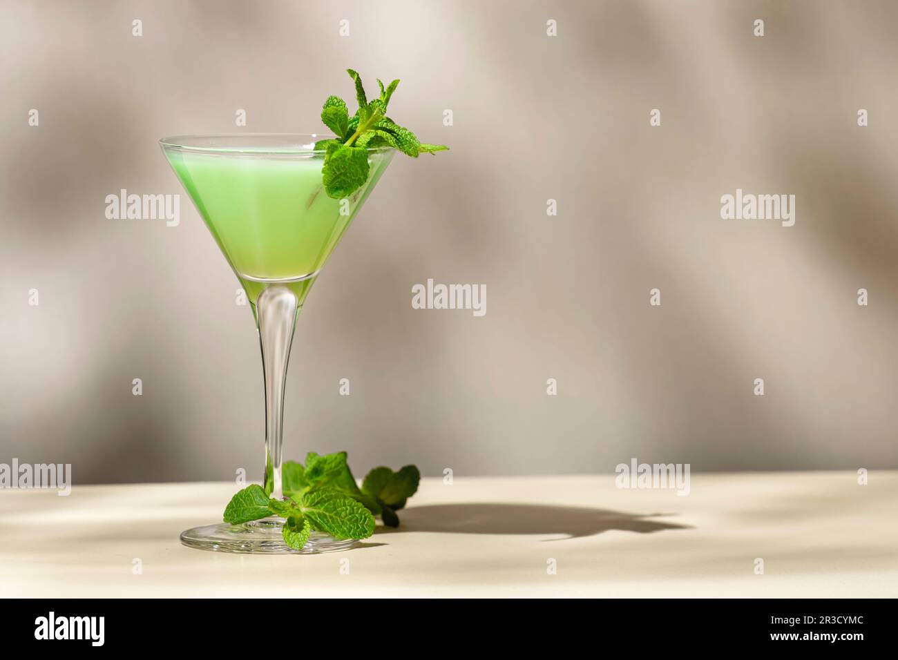 green alcoholic cocktail drink with mint liqueur, cream