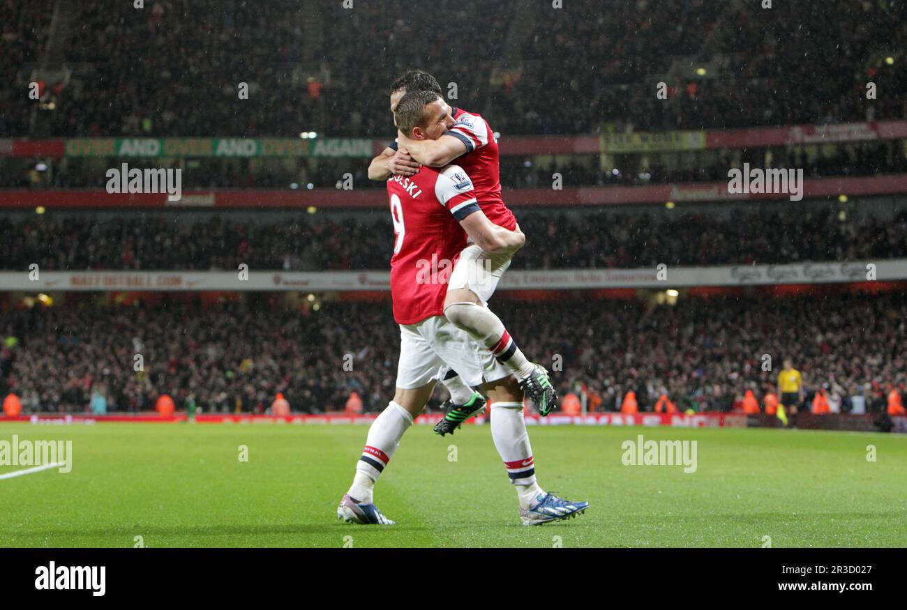 Arsenal's Lucas Podolski celebrates scoring his sides third goal with Arsenal's Santi Cazorla. Arsenal beat Wigan 4:1Arsenal 14/05/13 Arsenal V Wigan Stock Photo