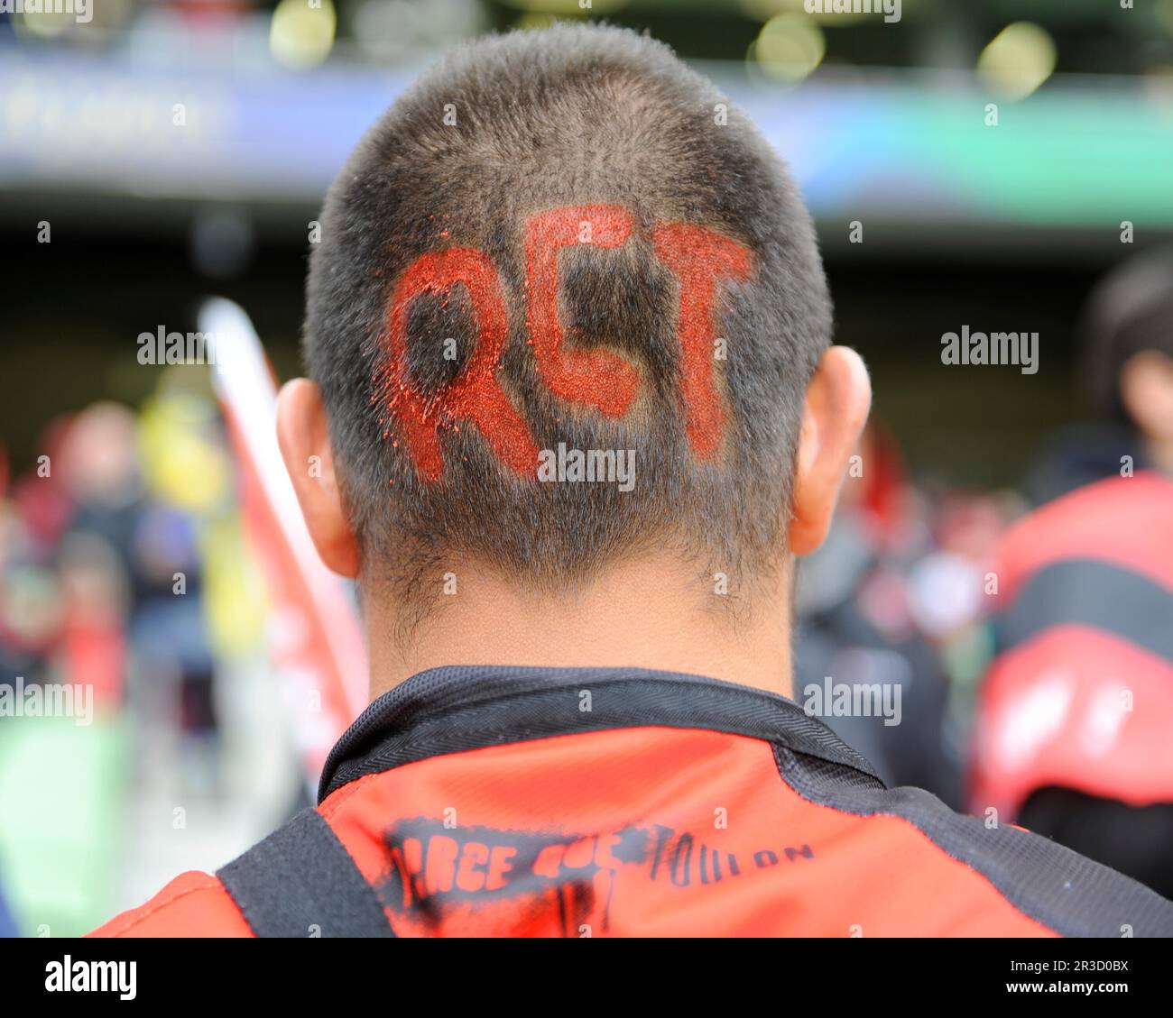 A Toulon fan shows commitment by shaving his head for the Heineken Cup