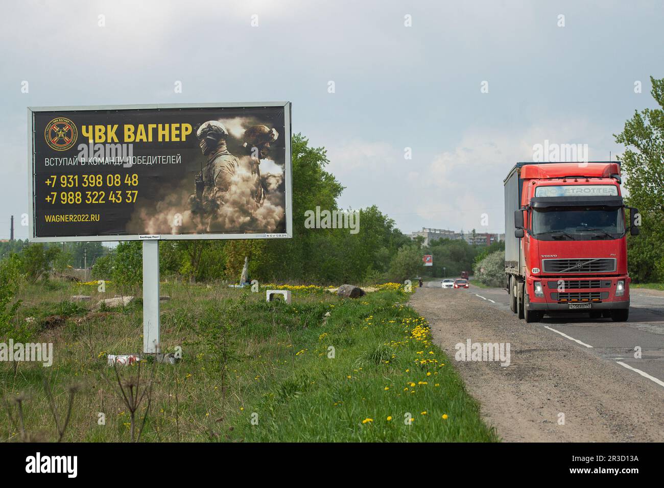 Saint Petersburg, Russia. 22nd May, 2023. A truck drives past a billboard on a highway near St. Petersburg in the Leningrad Region depicting Russian servicemen and an advertisement for a private military company, PMC Wagner, with the inscription ''Join the winning team''. On May 20, 2023, the founder of a private military company, Yevgeny Prigozhin, made a statement that the PMC Wagner group had completely taken the city of Bakhmut under its control. (Credit Image: © Artem Priakhin/SOPA Images via ZUMA Press Wire) EDITORIAL USAGE ONLY! Not for Commercial USAGE! Stock Photo