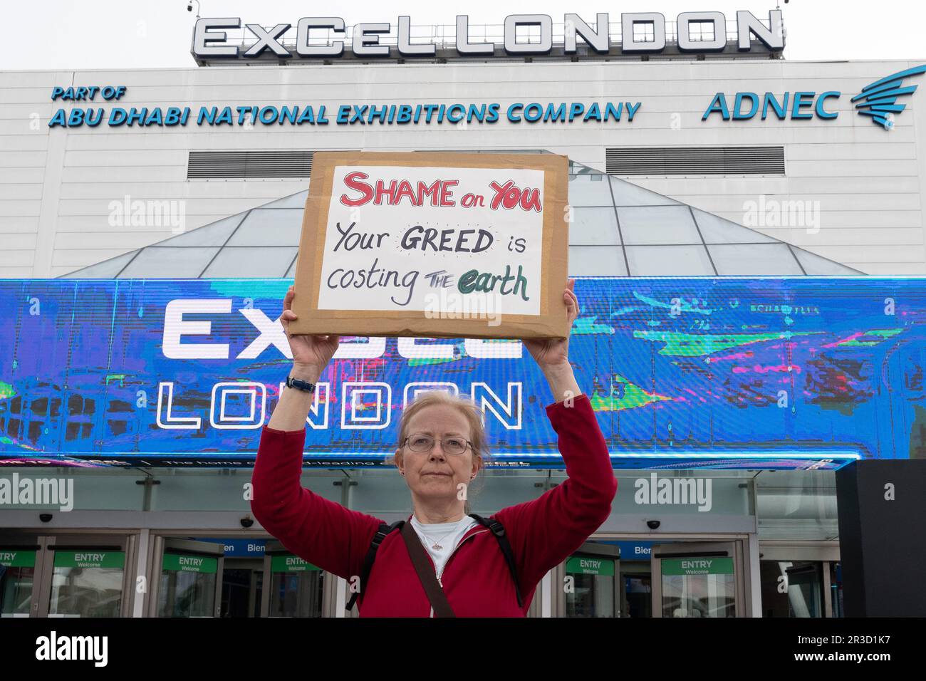 London, UK. 23 May, 2023. Climate activists protest outside the Annual General Meeting of oil giant Shell at the Excel Centre in docklands, calling on the company to drop plans to expand extraction of the fossil fuels responsible for global heating if we are to meet Paris climate targets on CO2 reduction and temperature increases. The company has enjoyed large profits while consumers faced record energy prices. Credit: Ron Fassbender/Alamy Live News Stock Photo