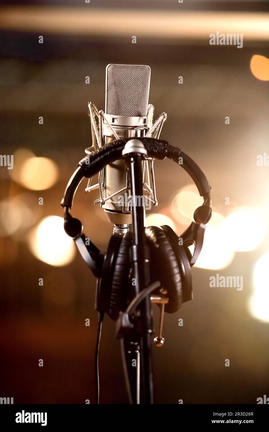 Headphones and Condenser Microphone in a Music Recording Studio Stock Photo