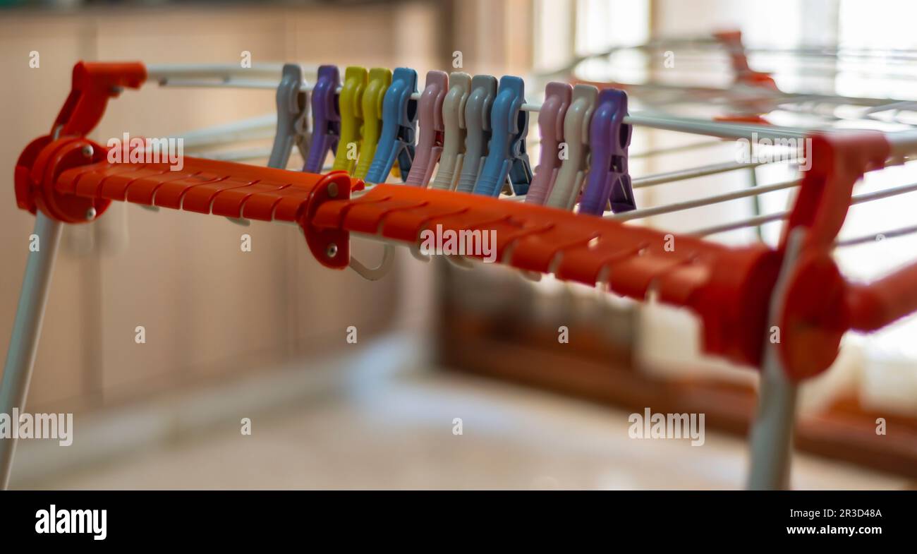 Multicolored clothespin / clothes peg on a foldable / collapsible