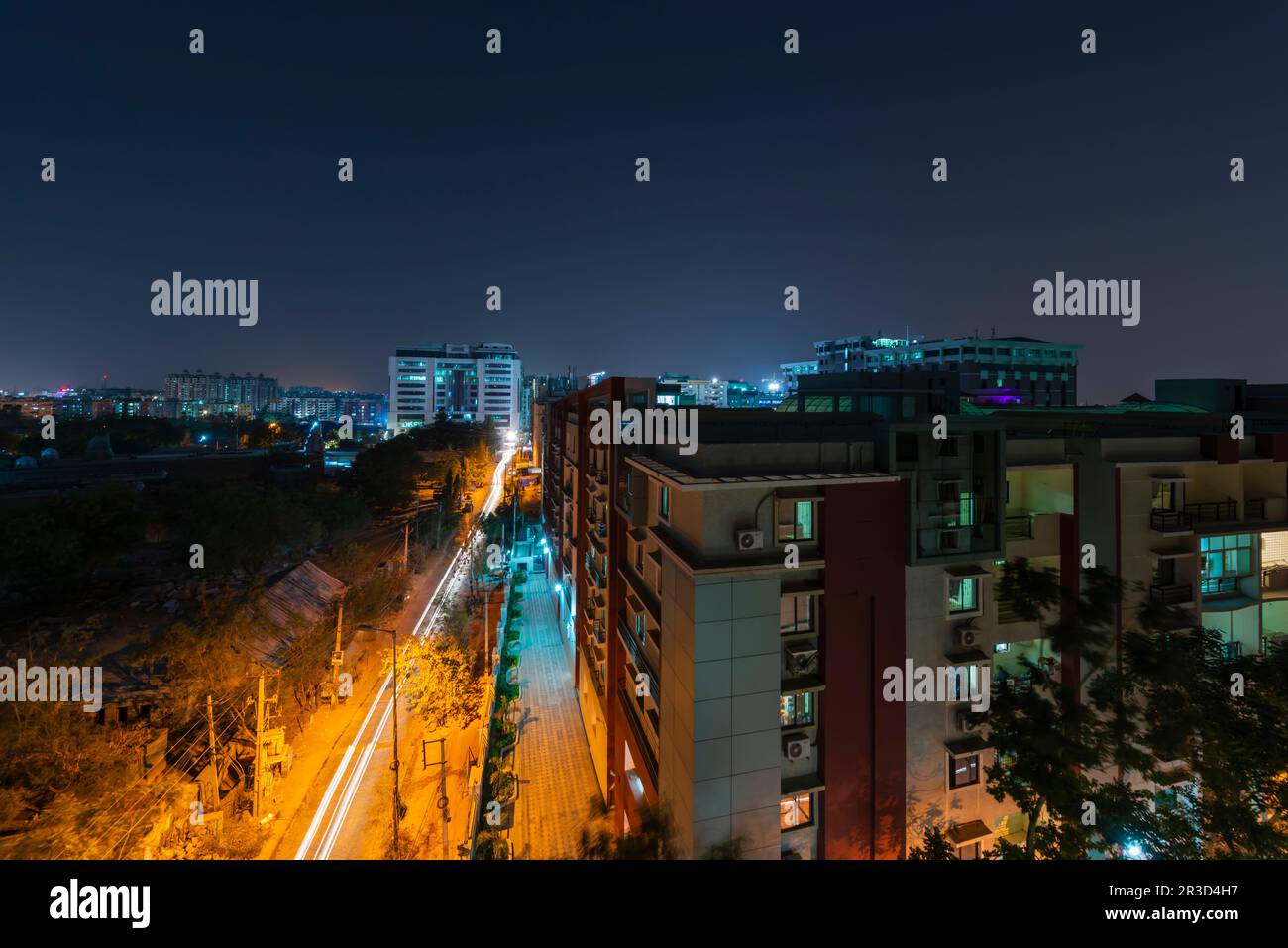 A nightscape of Kondapur, Hyderabad, Telangana. Light trails from vehicles entering or leaving Whitefields . Stock Photo