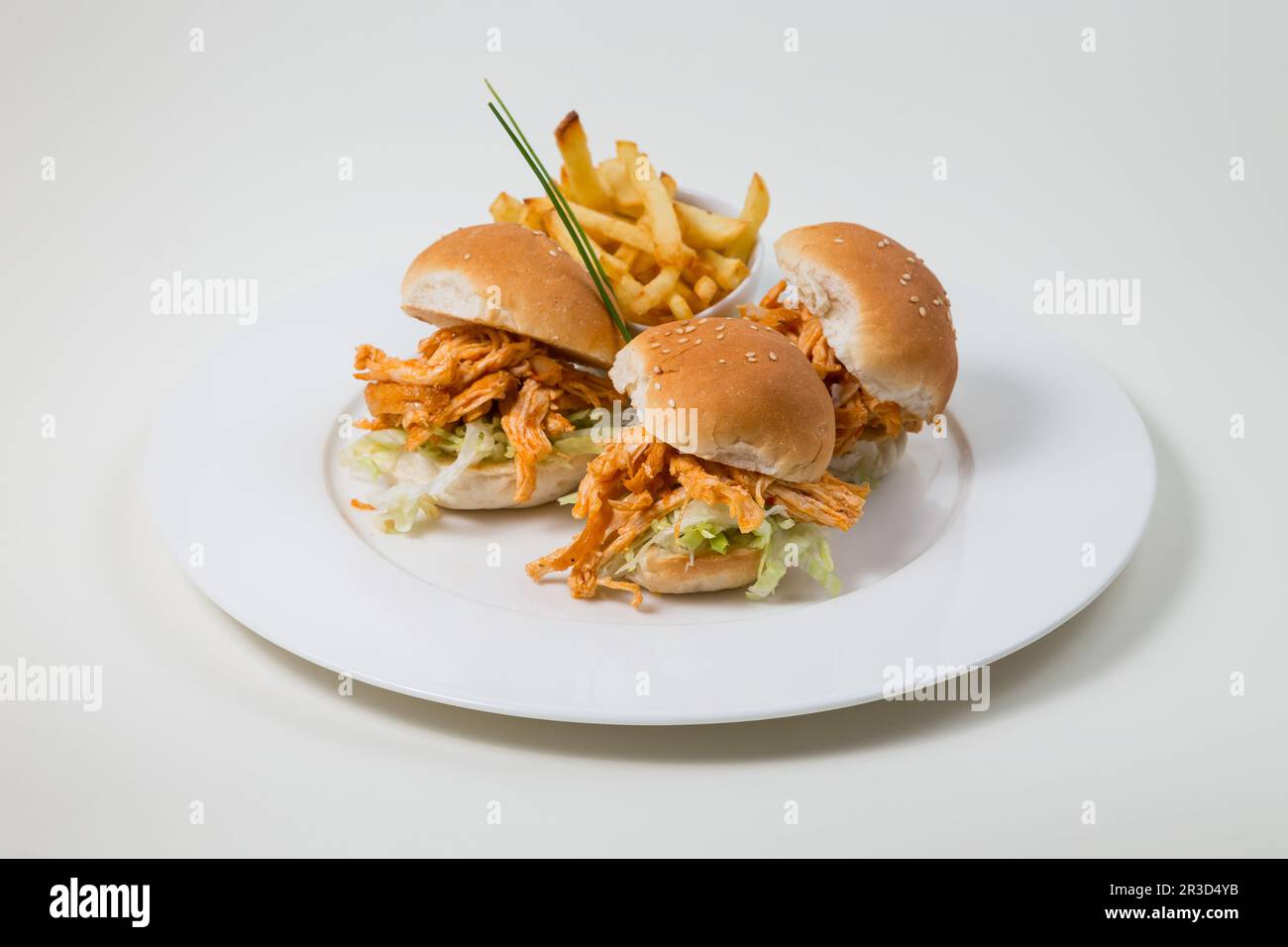 Chicken Burger and Fries on a white plate on a white background isolated Stock Photo