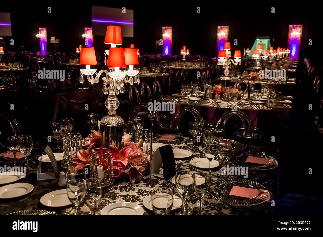 Decor with candles, flowers and lamps for a large corporate party event or Gala Dinner Stock Photo