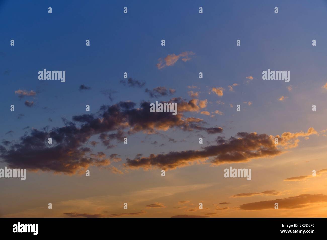 Clouds blue sky background during sunset Stock Photo - Alamy