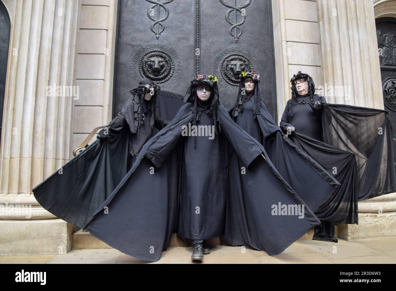 London, UK. 23rd May 2023. Extinction Rebellion 'Oil Slicks' troupe stage a protest outside the Bank of England, calling for an end to fossil fuel financing. Credit: Vuk Valcic/Alamy Live News Stock Photo