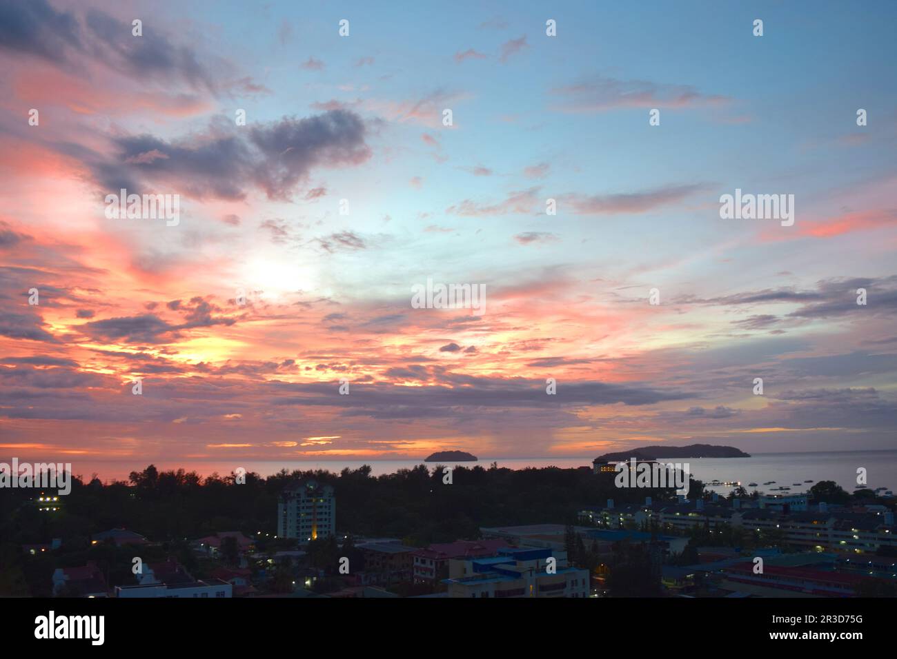 Dramatic sunset in Kota Kinabalu over sea, Malaysia. Stock Photo