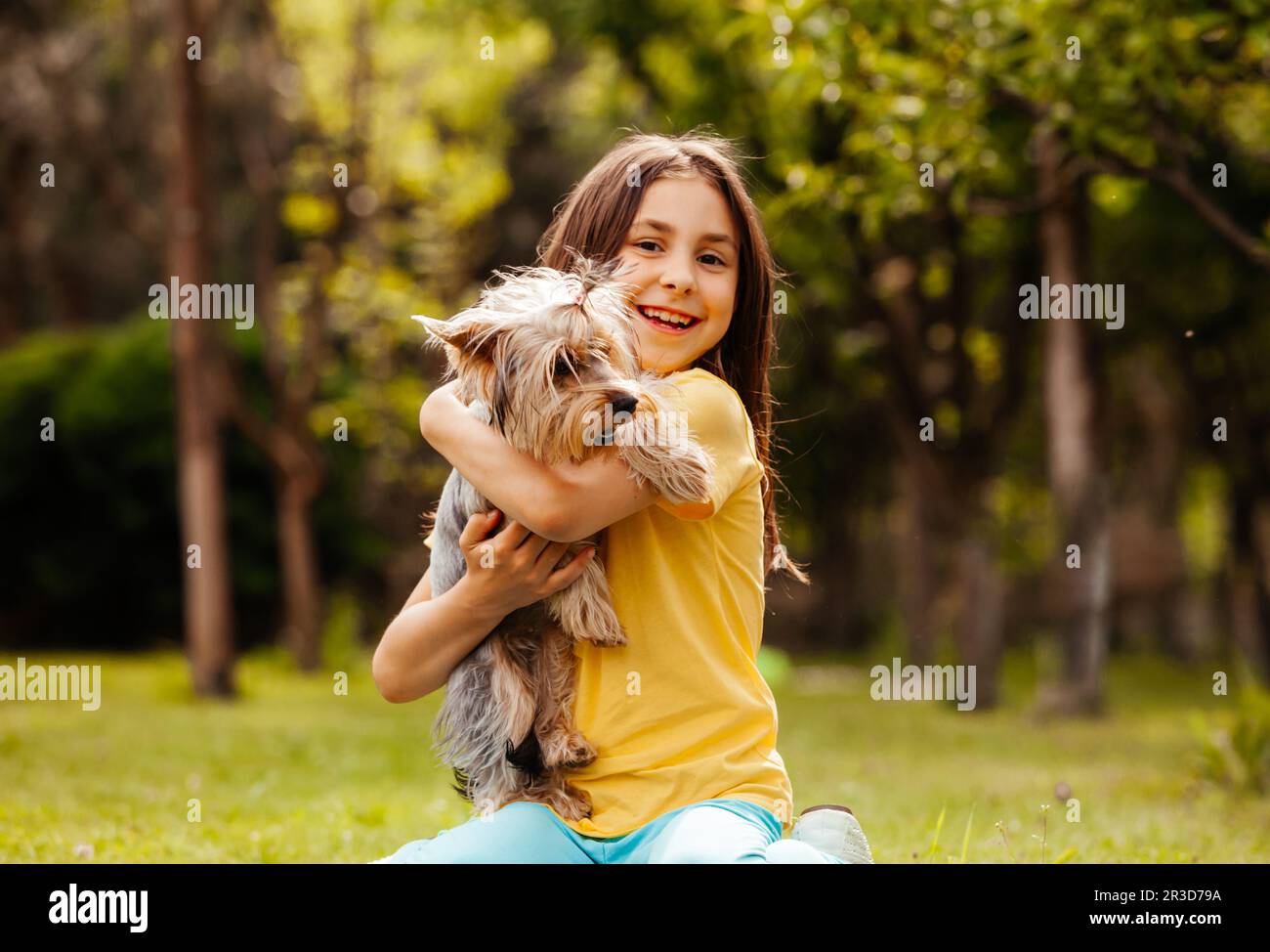 The pretty little girl shows off her small pet Stock Photo