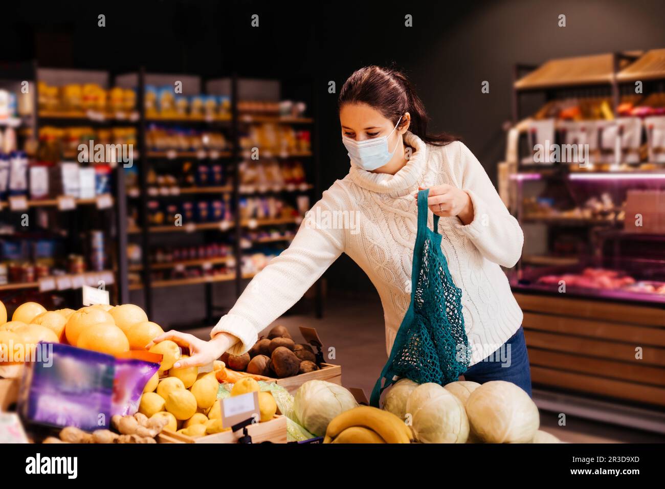 Young woman choosing eco-friendly way of shopping Stock Photo