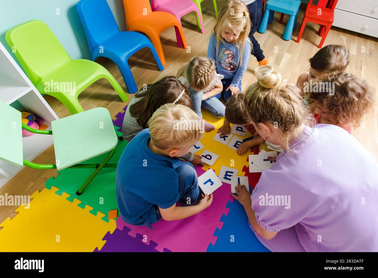 Educational group activity at the kindergarten or daycare Stock Photo