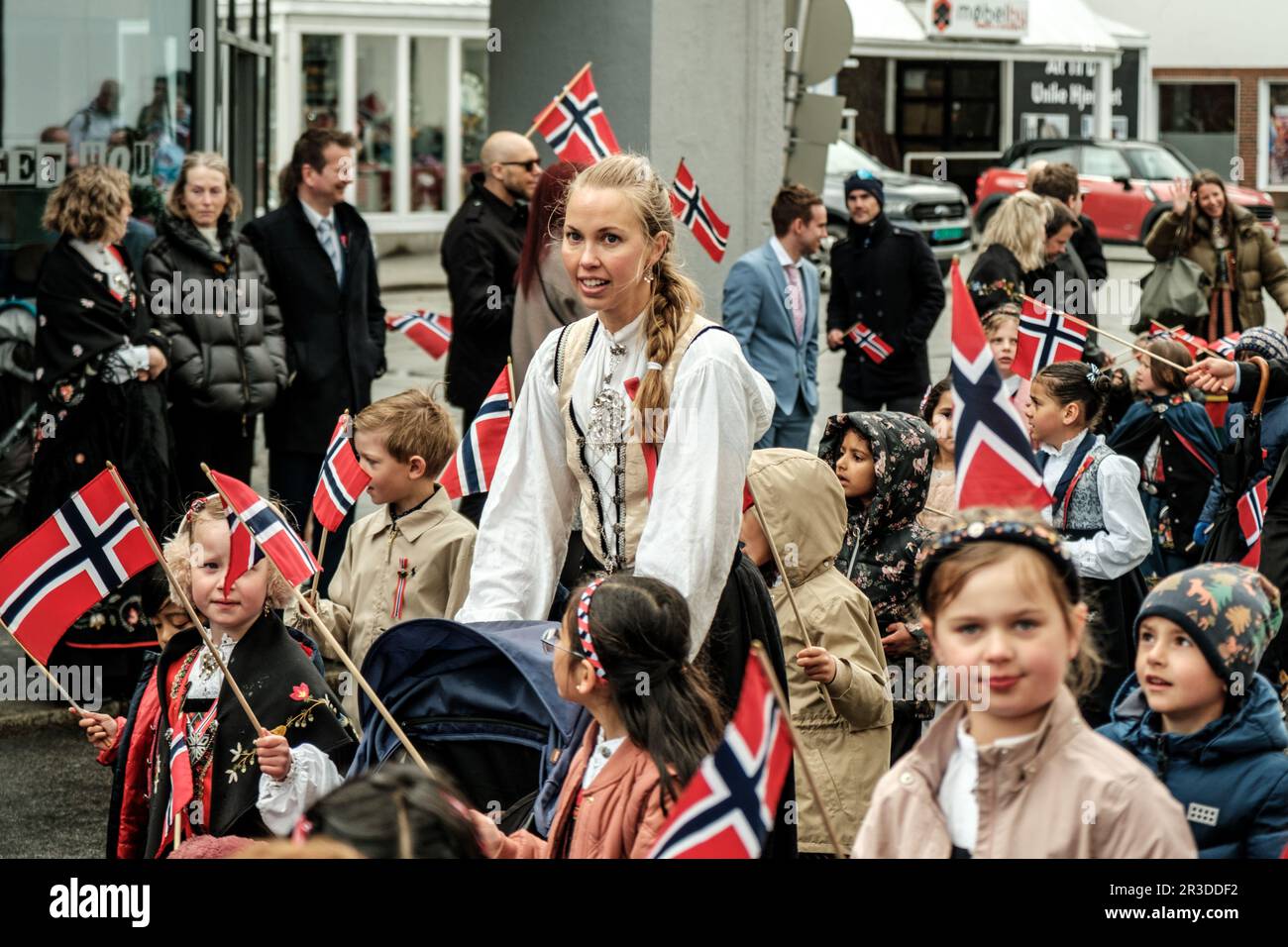 Sandnes, Norway, May 17 2023, Woman And Children In Traditional Dress With Norwegian Flags Walking During Independence Day Celebrations Sandnes Stock Photo