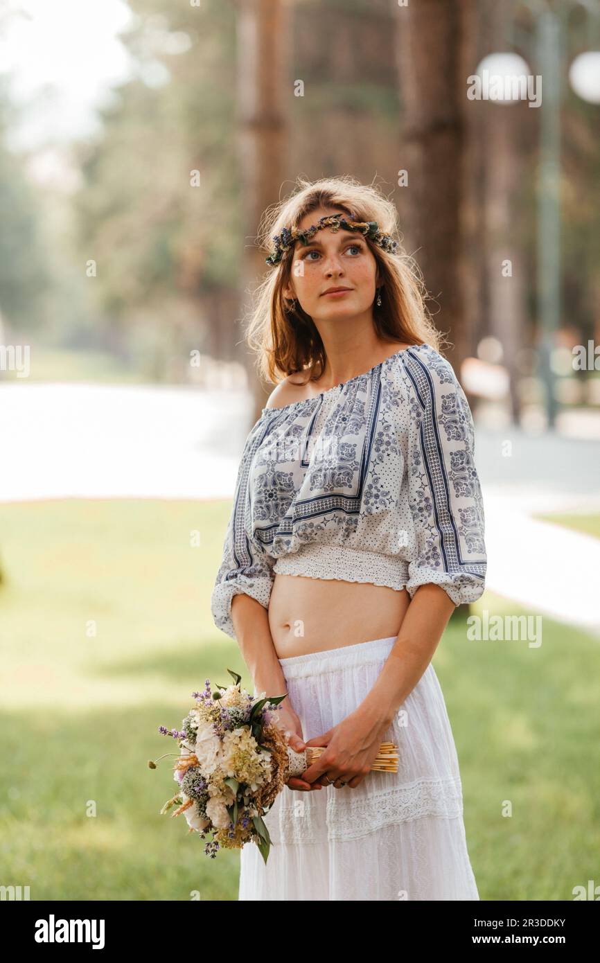 Stylish eclectic bride with wedding bouquet in the hands Stock Photo