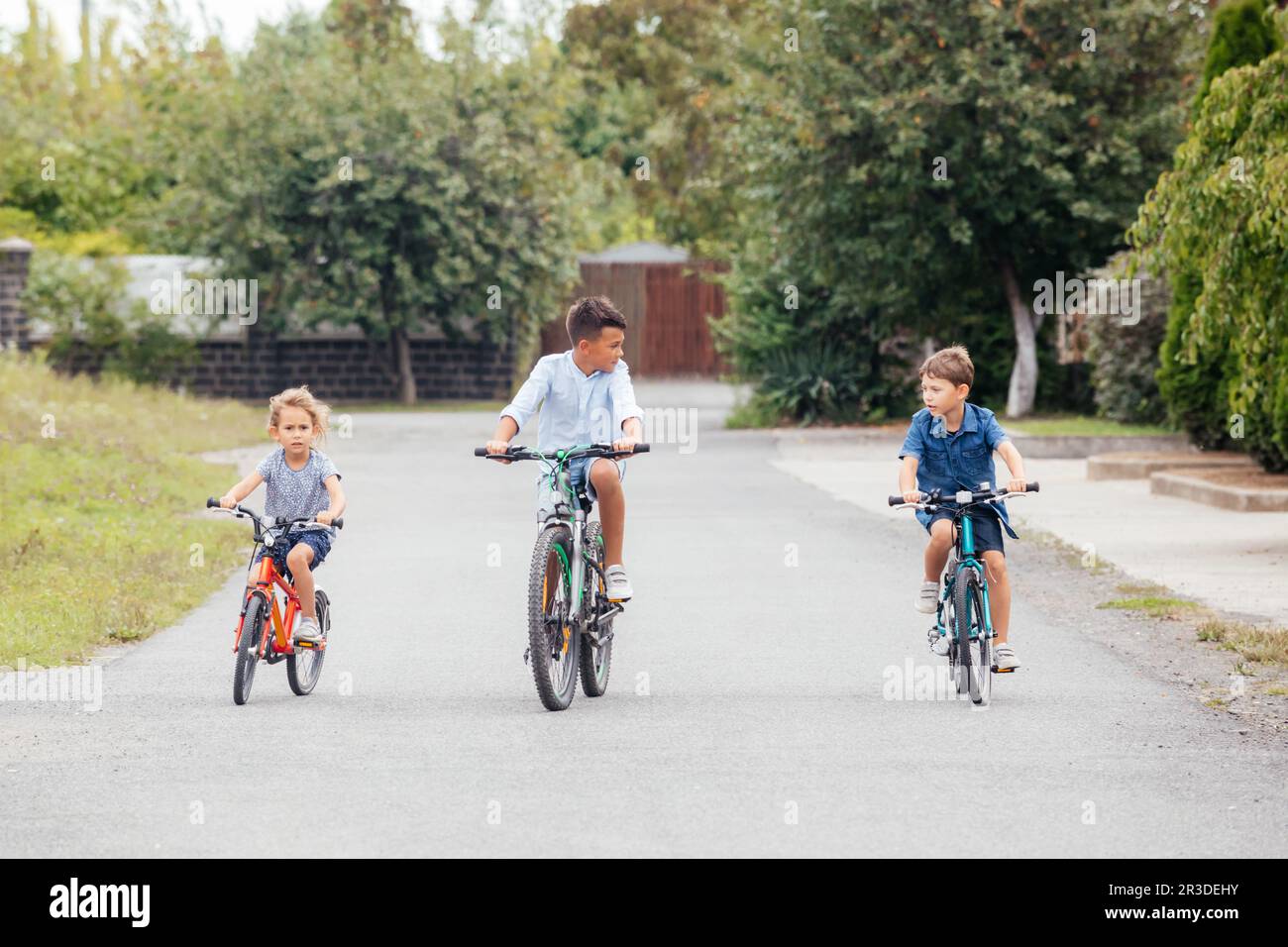 Kids have a leisure on bicycles outoodrs Stock Photo