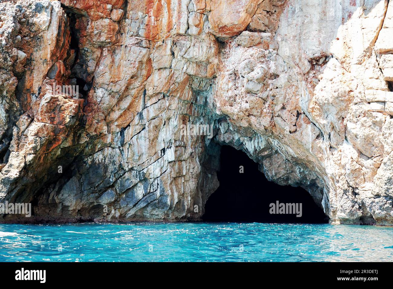Entrance hole into the famous Blue Cave in Montenegro. Landmarks and
