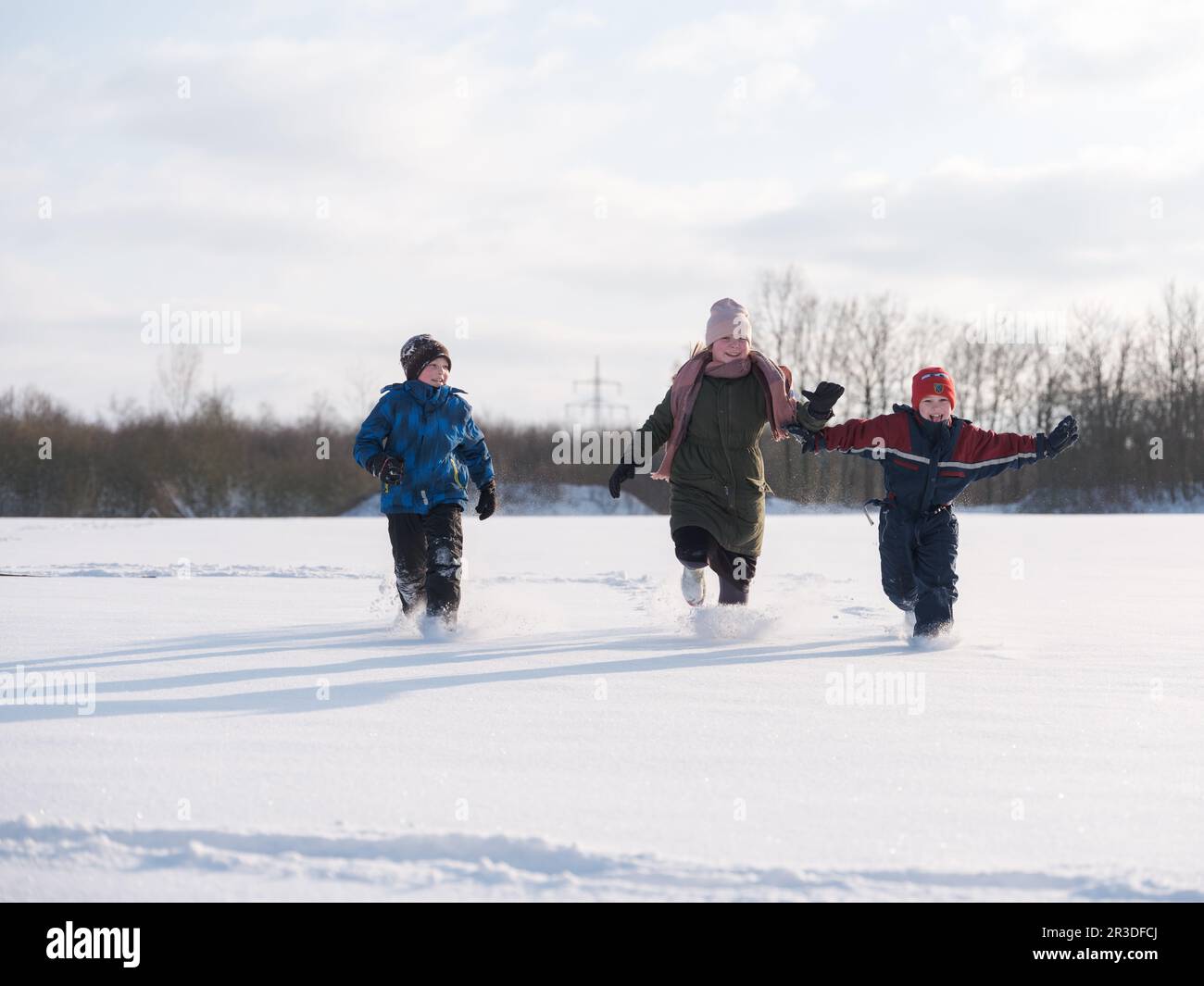 Children group playing running hi-res stock photography and images - Alamy