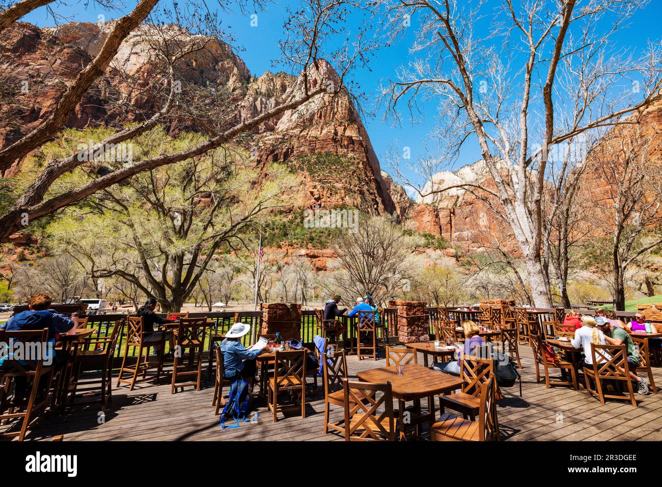 Tourists dine on the outside deck of Zion Lodge; Zion National Park; Utah; USA Stock Photo