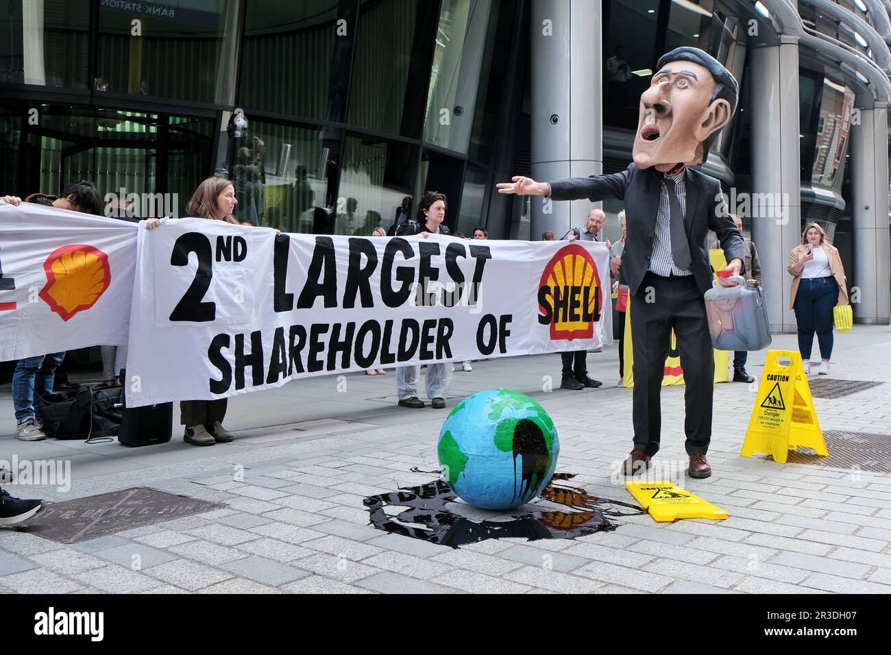 London, UK. 23rd May, 2023. Extinction Rebellion activists stage a protest outside the second largest Shell shareholder, Vanguard, in the City of London against the continued investment in fossil fuels and environmental destruction. On the day of the oil giant's AGM, activists protested by entering the meeting and demonstrated outside BlackRock. Credit: Eleventh Hour Photography/Alamy Live News Stock Photo