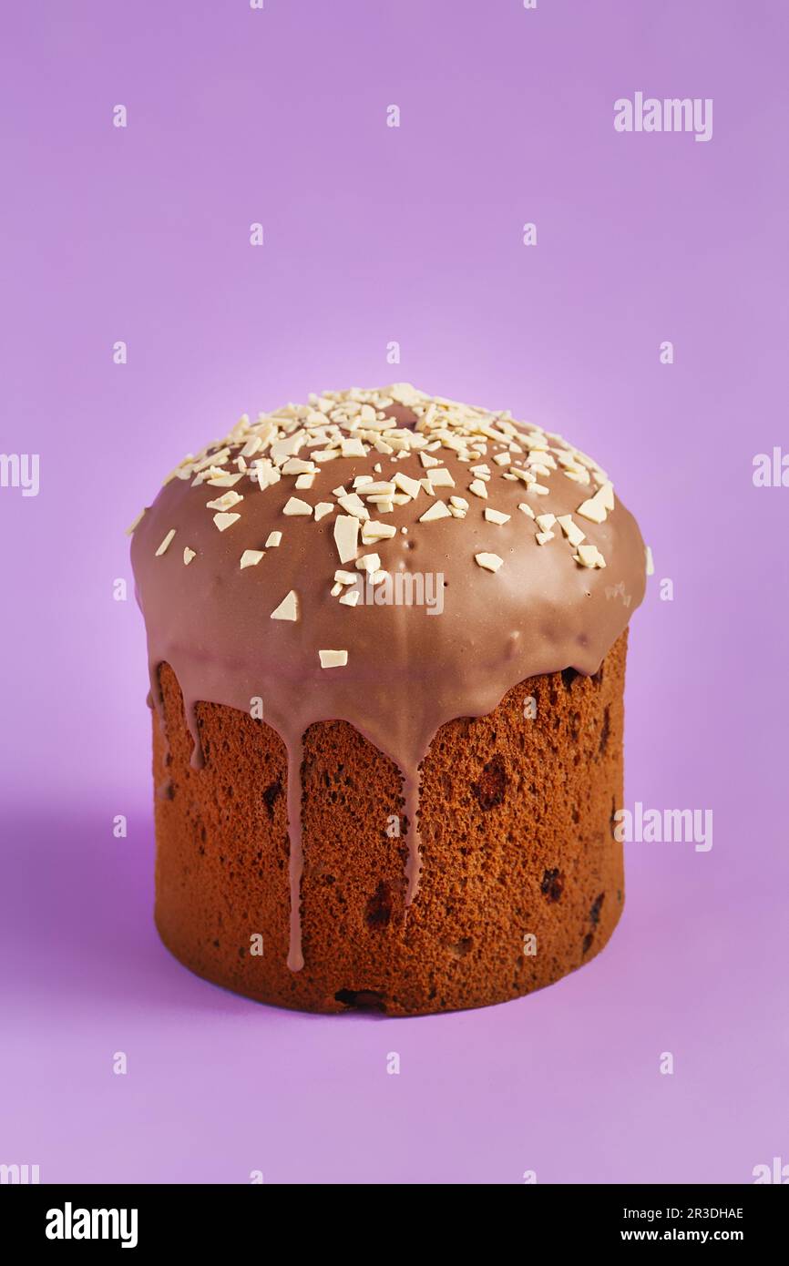 Easter Cake - Russian and Ukrainian Traditional Kulich on a bright lilac purple background. Paska Easter Bread. Happy easter. Ku Stock Photo