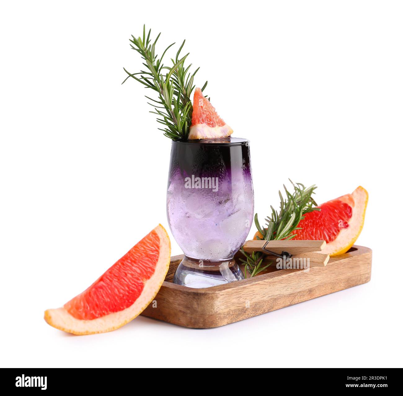 Glass of purple gin and tonic with grapefruit and rosemary on white