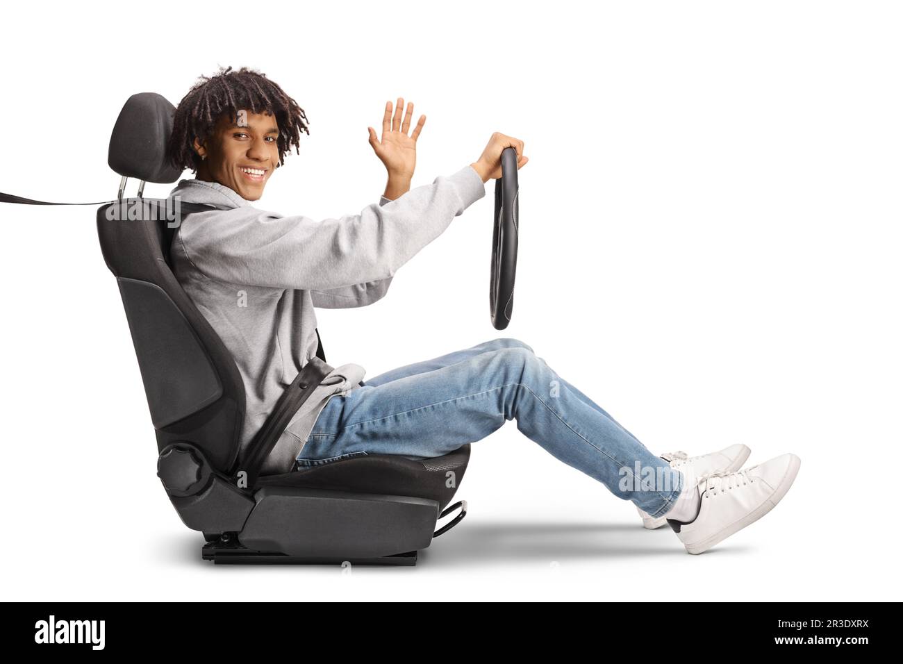 African american young man in a driver seat holding a steering and