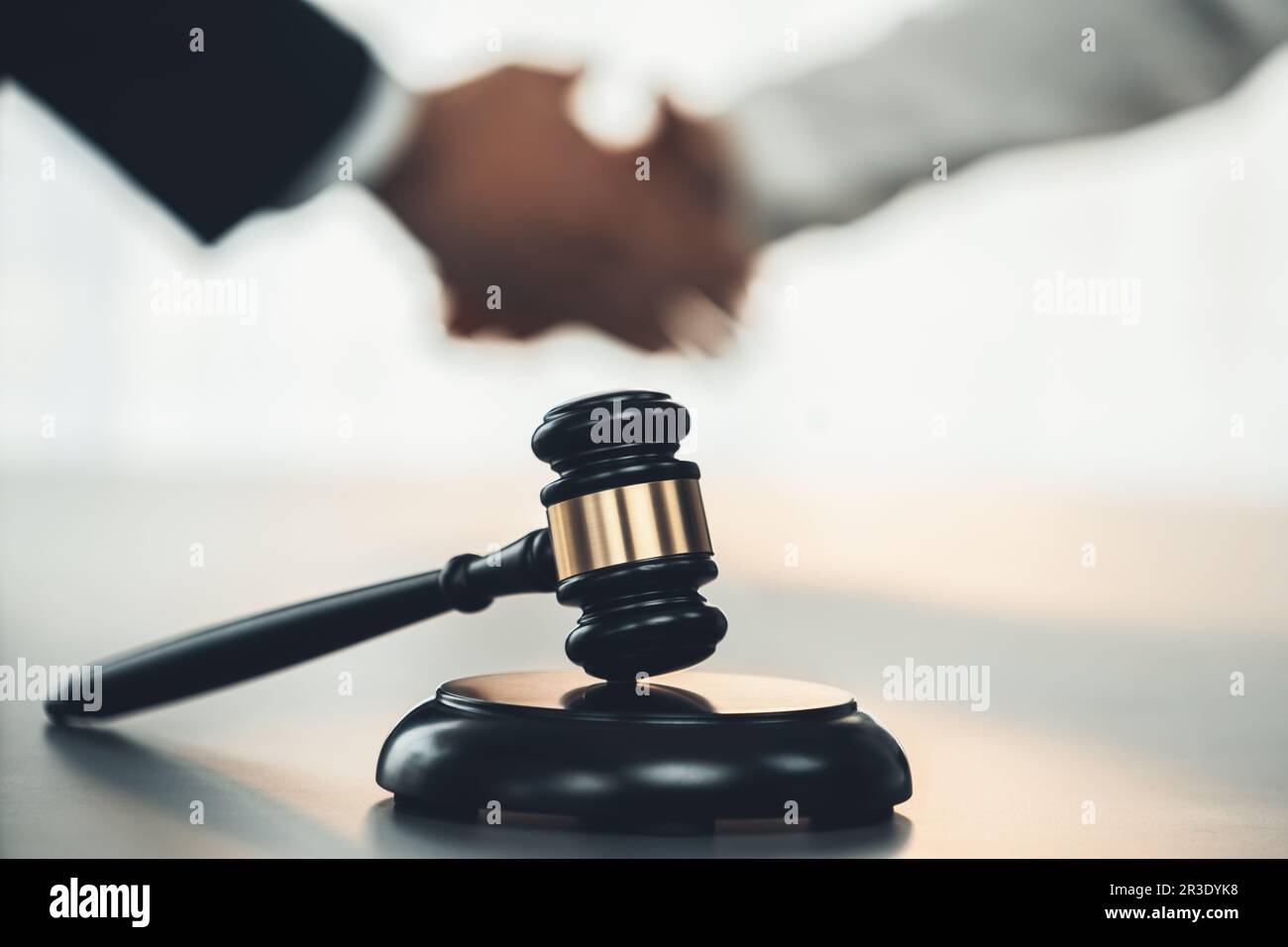 Focus gavel symbolize justice on blur background of lawyer colleagues
