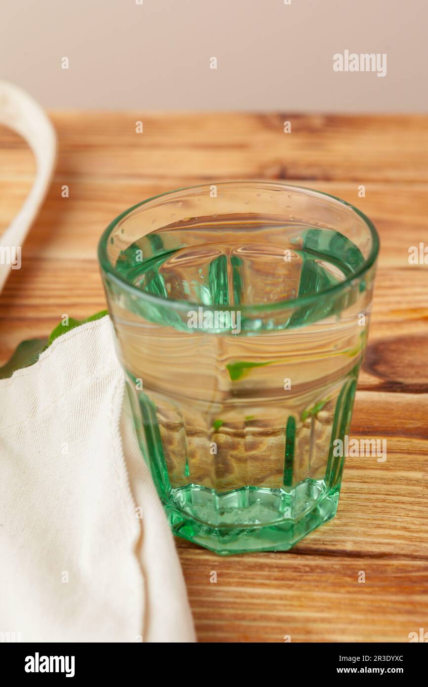 Mesh bags with reusable glass water bottle. Sustainable lifestyle. Zero  waste concept. No plastic. Stock Photo by FabrikaPhoto